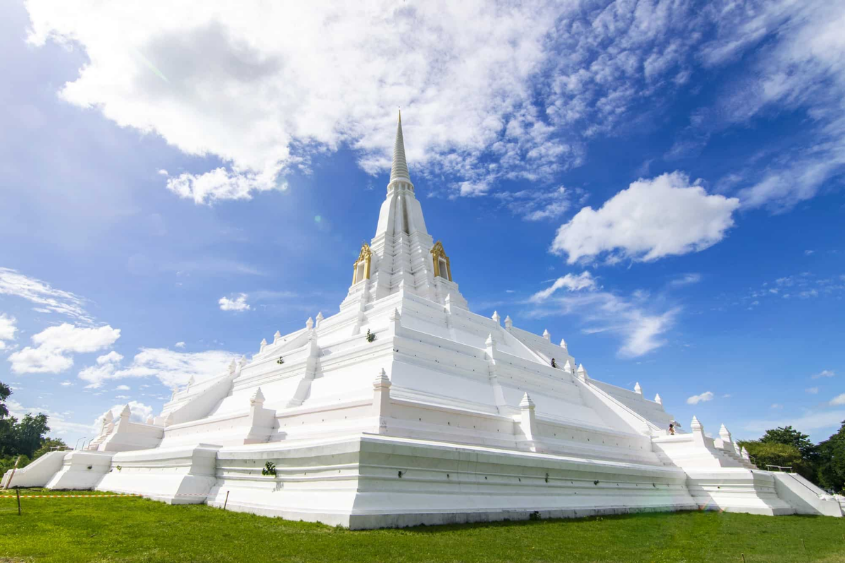 White chedi at Wat Phu Khao Thong rising above rice fields
